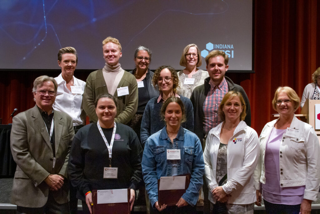 Winners of the poster awards pose with leadership