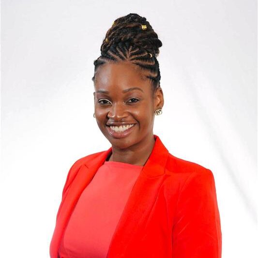 Omolola (Lola) Adeoye-Olatunde smiles in her headshot.